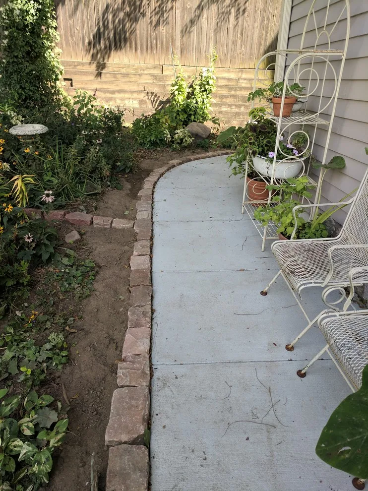 Stone Retaining Wall with Cobblestones by Markuson Mark III Construction - Photo 7