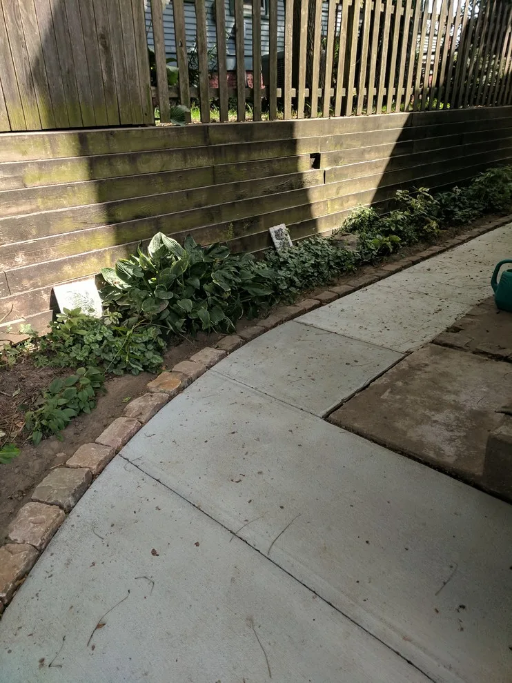 Stone Retaining Wall with Cobblestones by Markuson Mark III Construction - Photo 11