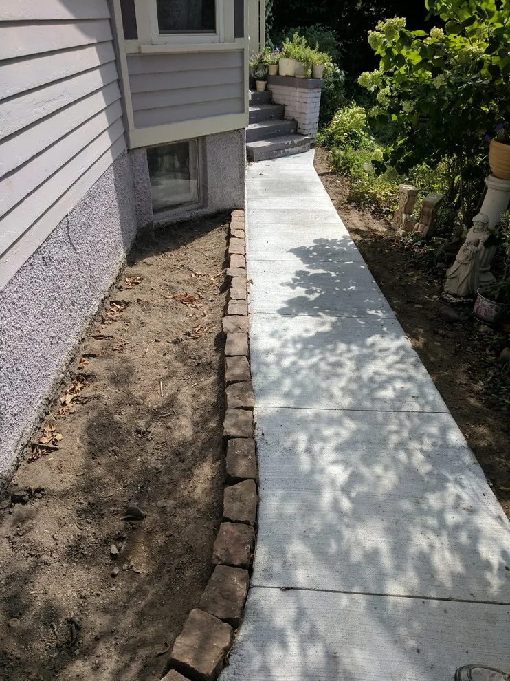 Stone Retaining Wall with Cobblestones by Markuson Mark III Construction - Photo 9