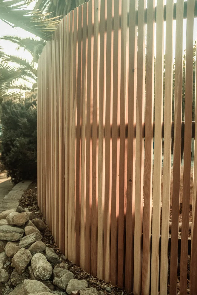 Curved Vertical Slats and Hogwire Fence with a Scenic View by Swan General Homestead - Photo 6