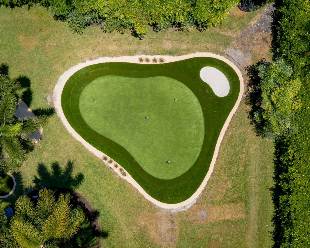 PRIVATE BACKYARD CELEBRITY GREENS PUTTING GREEN by The Landscaping People, Inc. - Photo 15