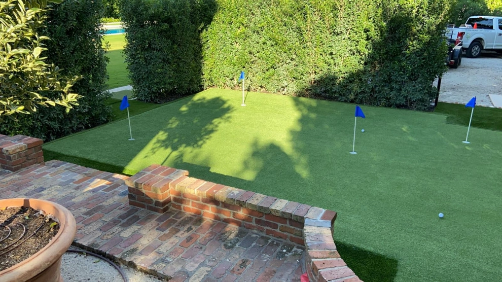 PUTTING GREEN WITH ARTIFICIAL TURF by The Landscaping People, Inc. - Photo 9