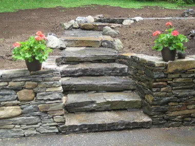 Landscaped stairs, walls, and pathways by Rock Solid Solutions - Photo 5