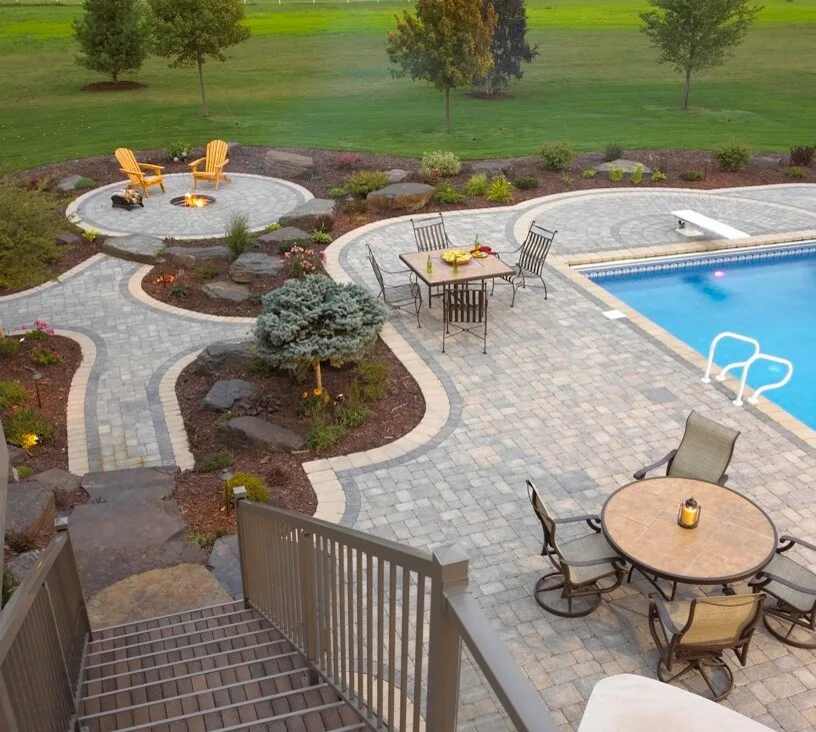 Versatile Poolside: Paver Patio with Fire Pit and Seating Areas by Anchor Block Company - Photo 2