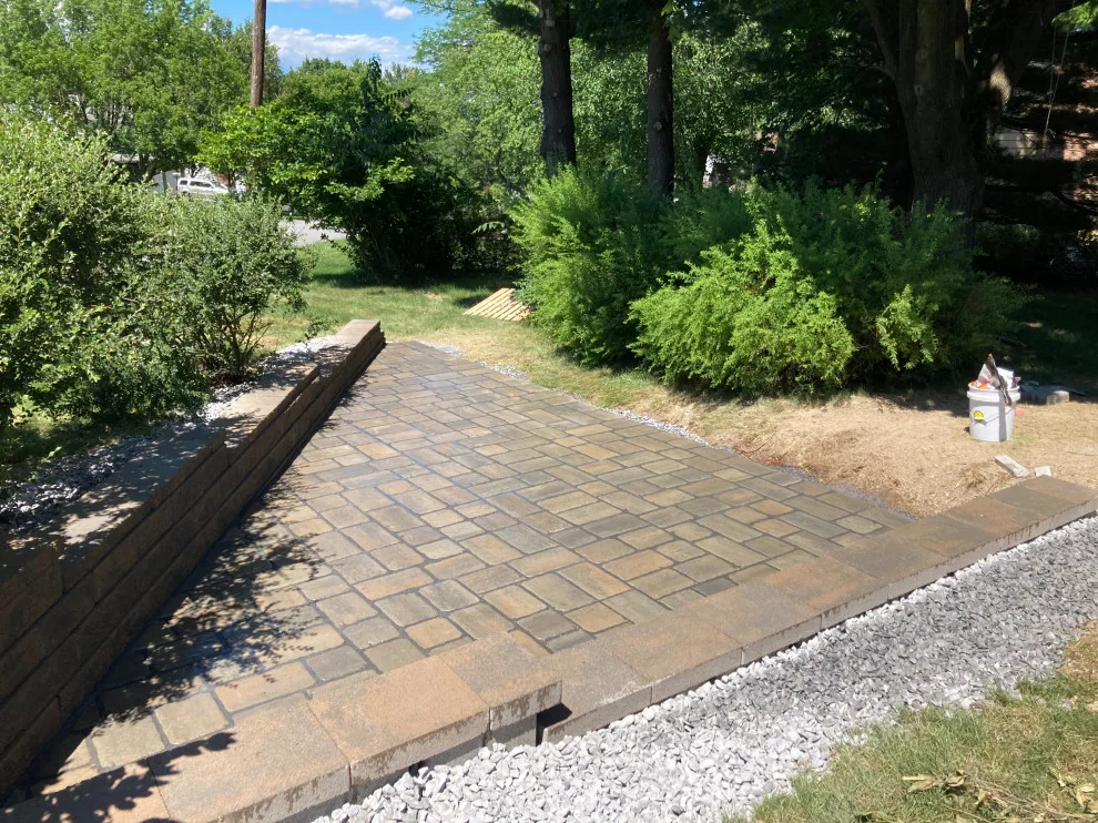 Retaining wall paver patio by Legacy Masonry & Hardscaping - Photo 3