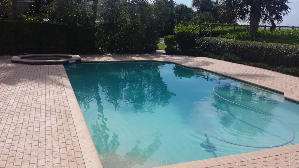 Swimming Area Patios by Island Exteriors, LLC - Photo 8