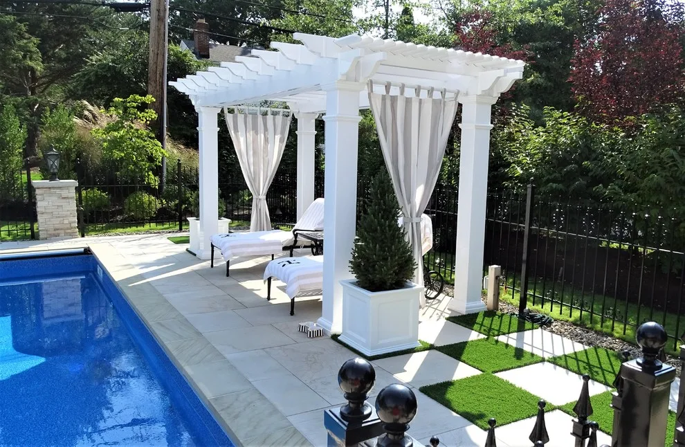 Checkerboard Turf Pool Project with Stone Patio by Land Creations Landscaping Inc. - Photo 4
