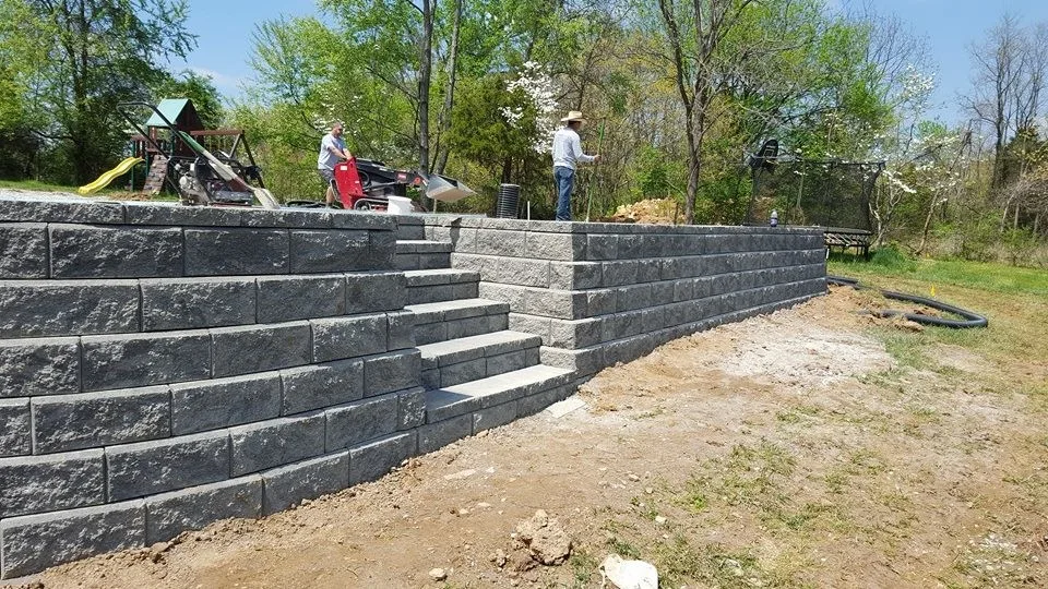 Poolside Retaining Wall Installation by Advanced Grounds Maintenance, LLC - Photo 4