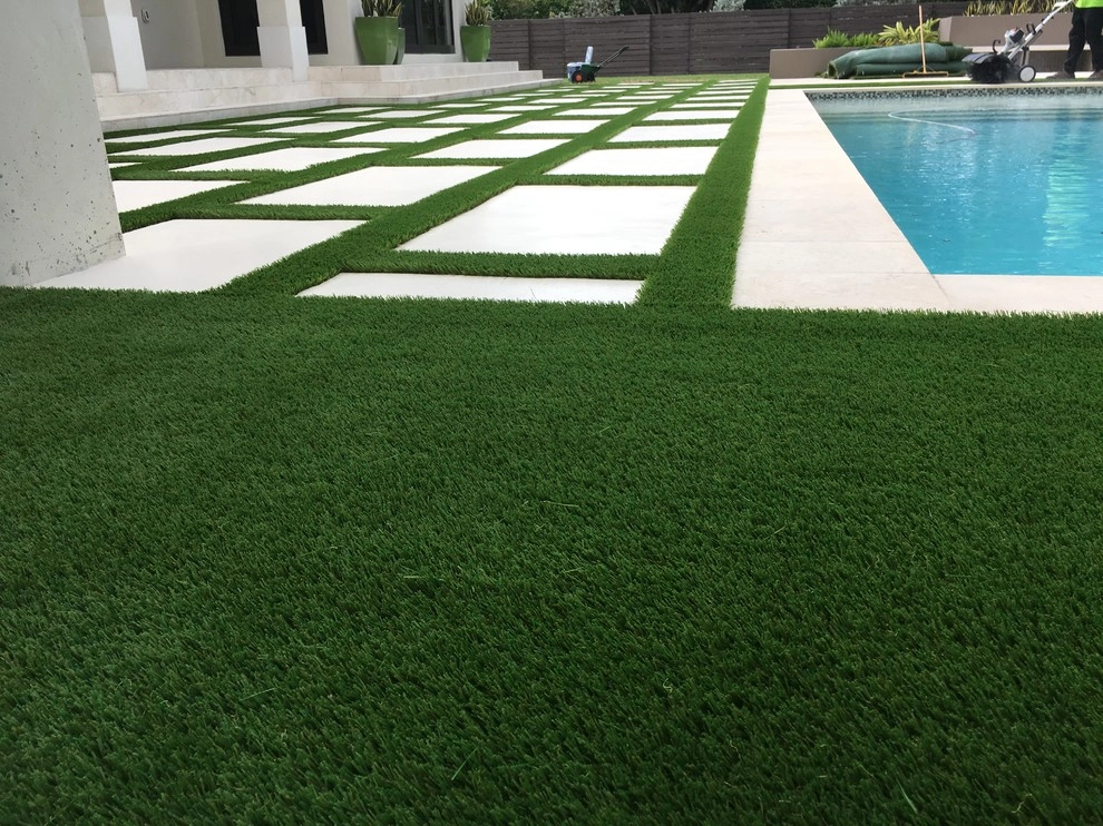Baptist area backyard pool area by Tropical Turf - Photo 2