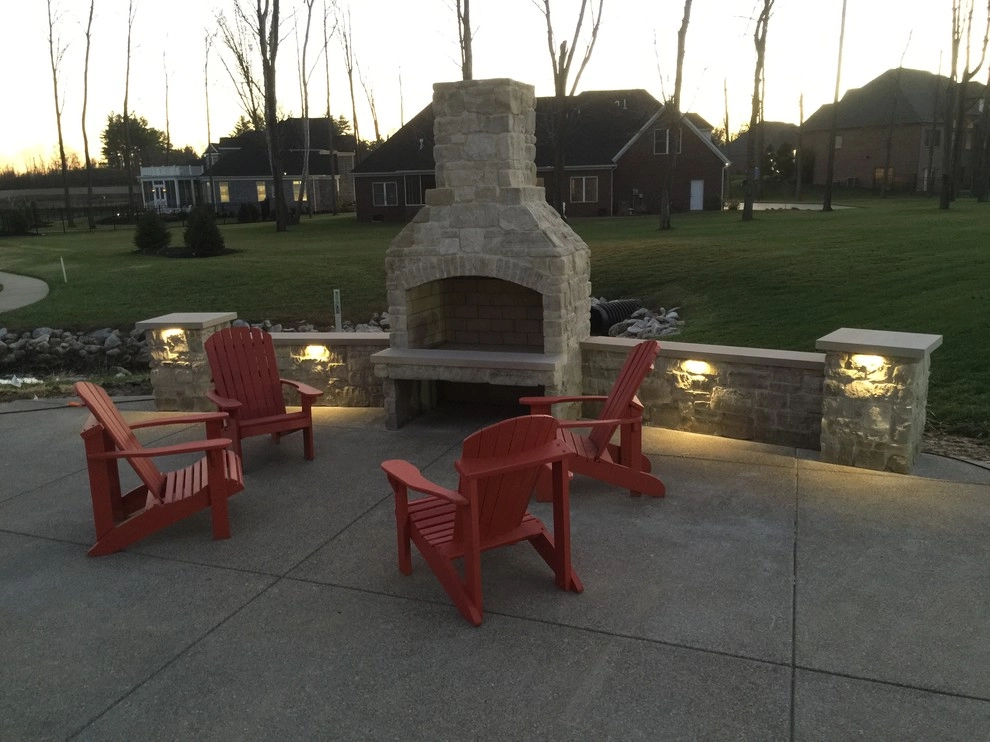 stone fireplace by VIVID Landscape & Lighting - Photo 2