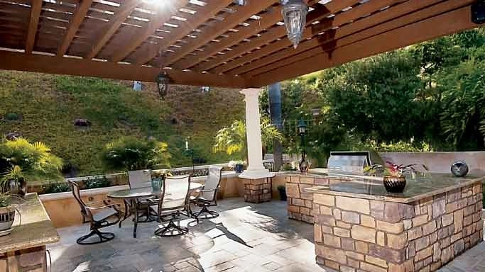 Outdoor Living Space with Kitchen and BBQ by Ocean Blue Pools And Landscaping - Photo 3