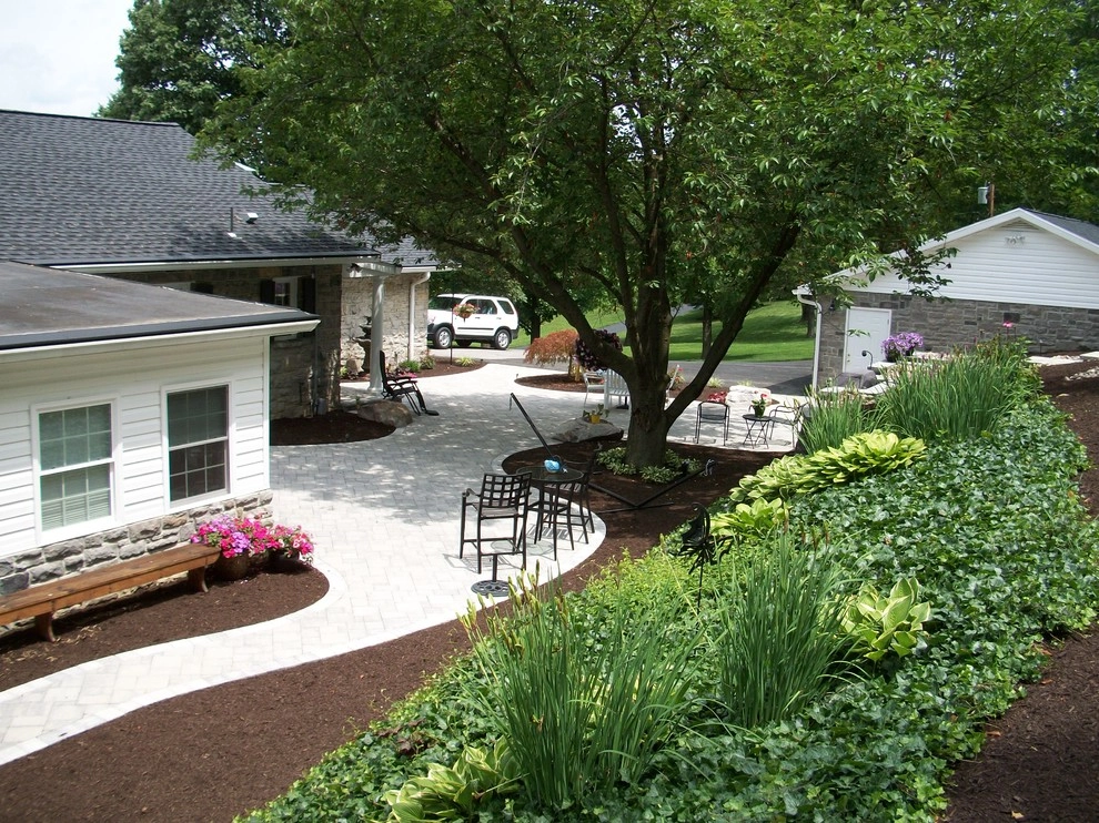 A Shaded Backyard Patio by Weavers Landscape Company - Photo 13