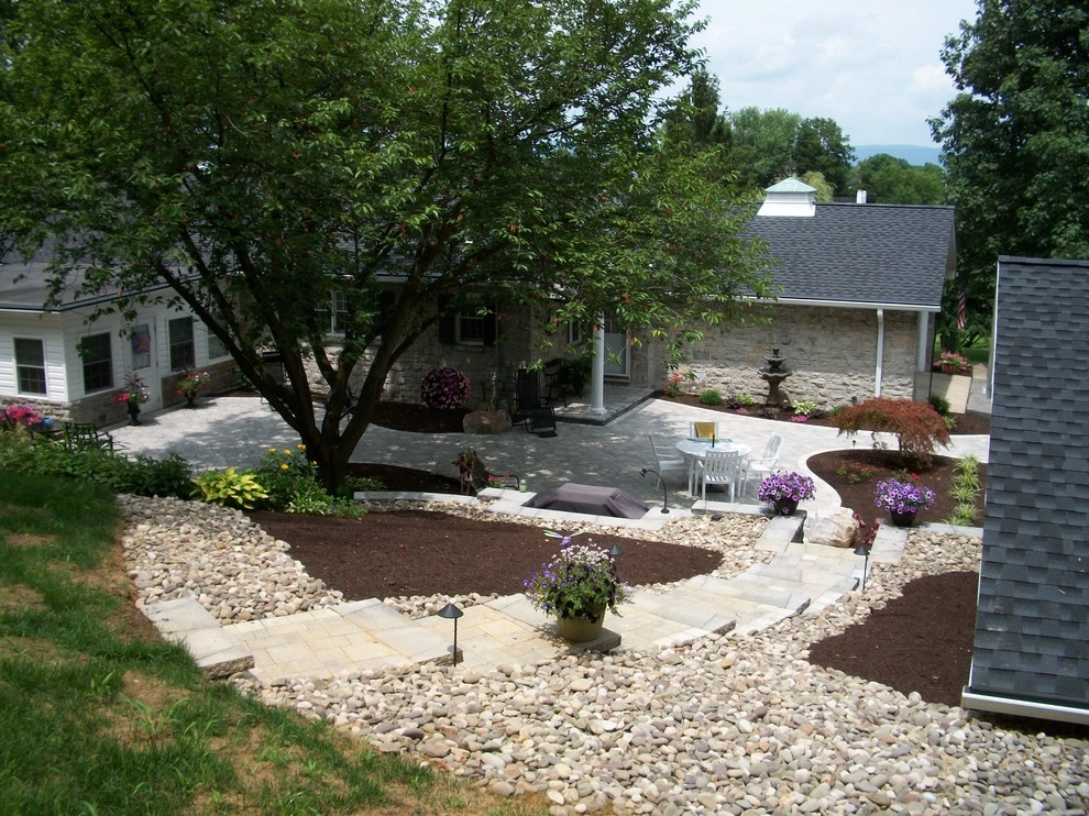 A Shaded Backyard Patio by Weavers Landscape Company - Photo 12