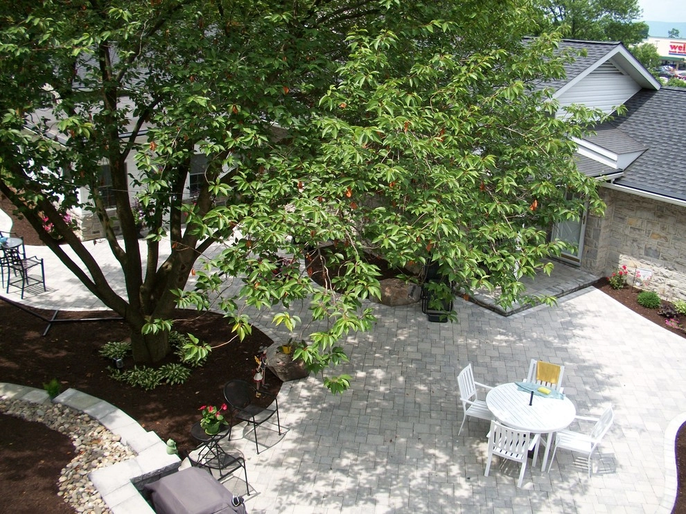 A Shaded Backyard Patio by Weavers Landscape Company - Photo 6