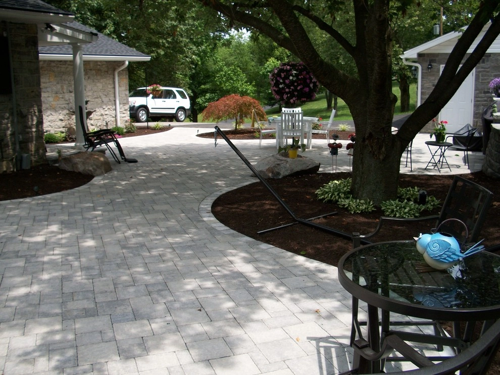 A Shaded Backyard Patio by Weavers Landscape Company - Photo 11