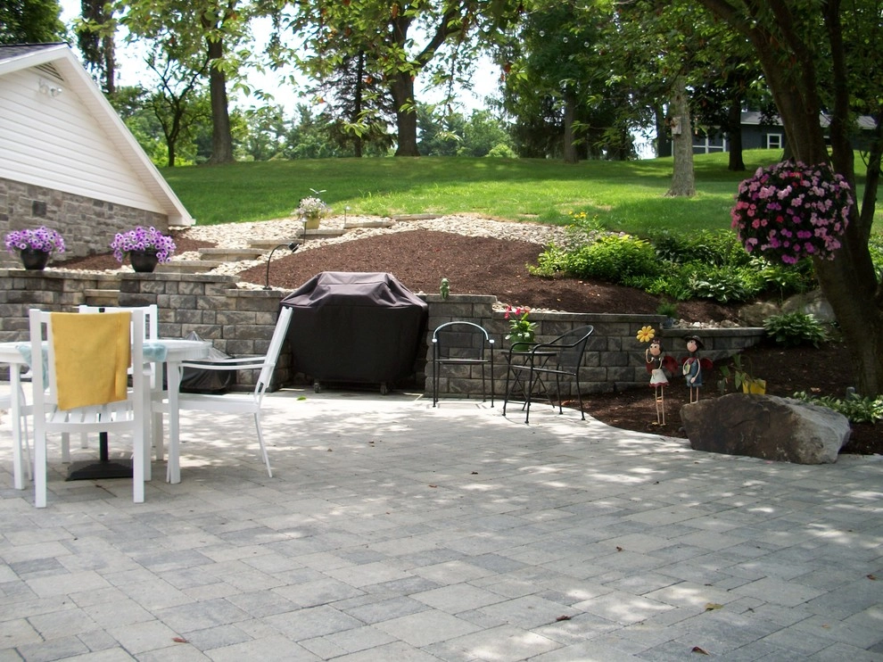 A Shaded Backyard Patio by Weavers Landscape Company - Photo 9
