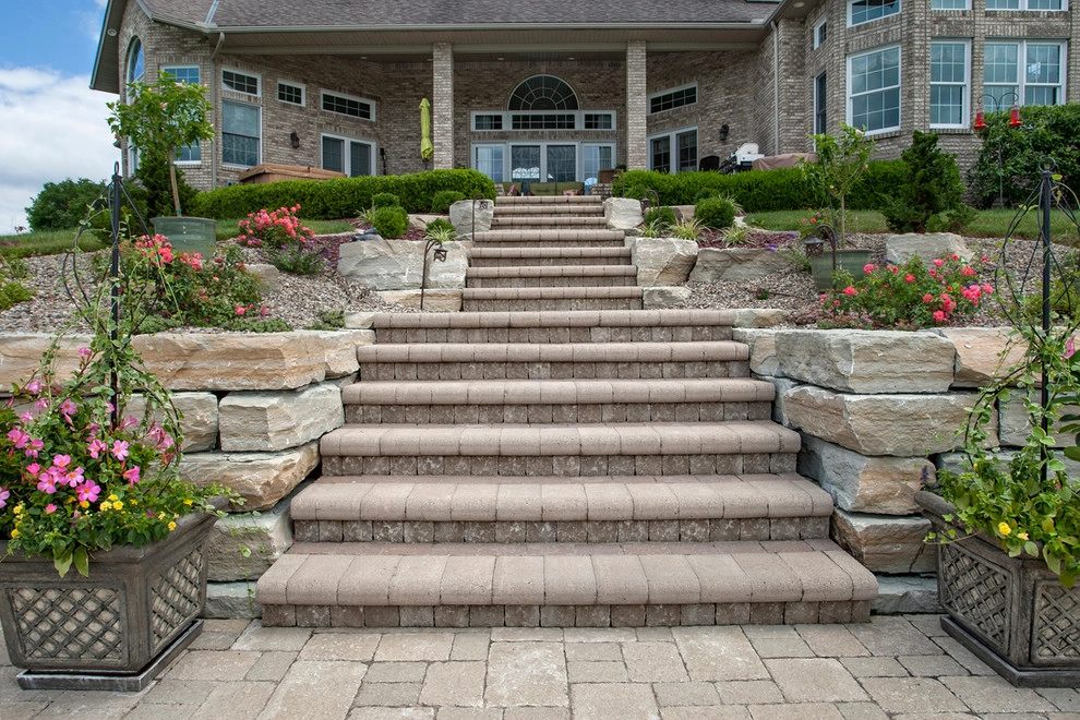 Poolside on a hillside by Winland's Complete Landscaping Service - Photo 9