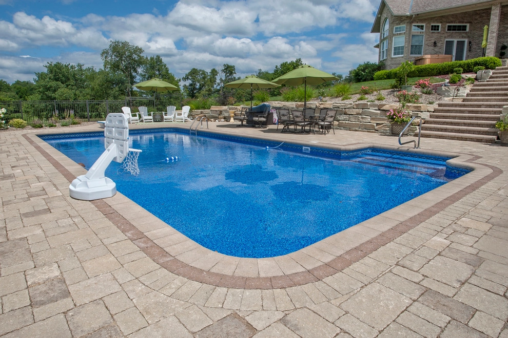 Poolside on a hillside by Winland's Complete Landscaping Service - Photo 8