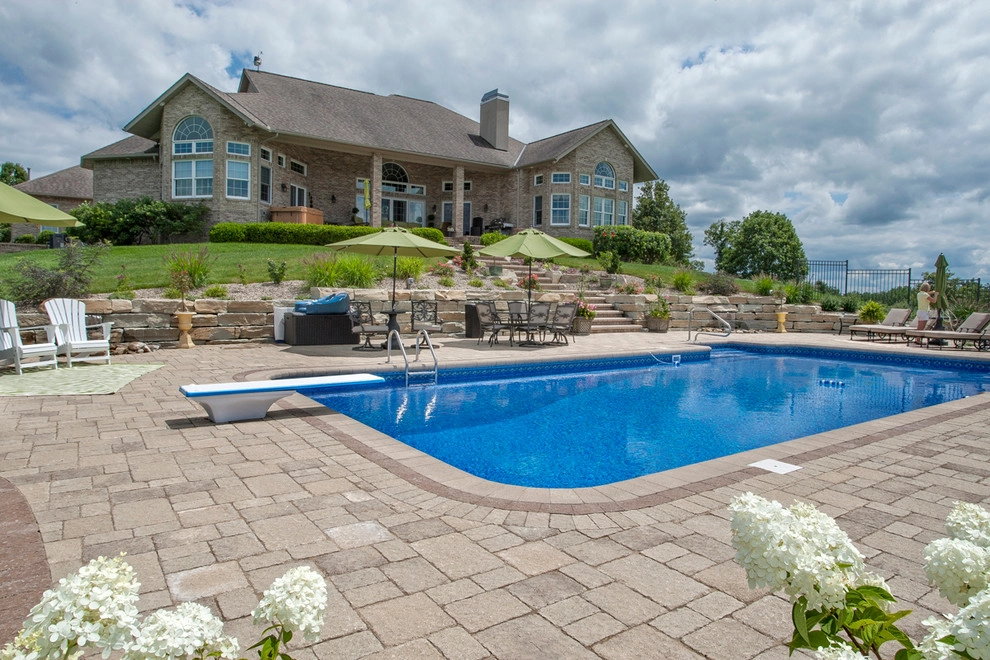 Poolside on a hillside by Winland's Complete Landscaping Service - Photo 6