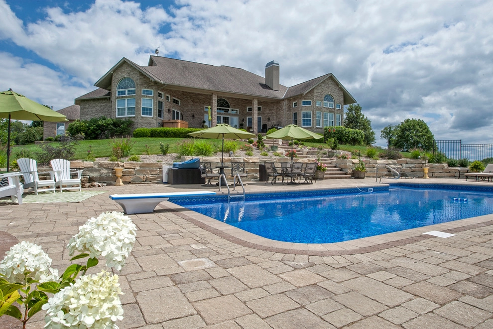 Poolside on a hillside by Winland's Complete Landscaping Service - Photo 7