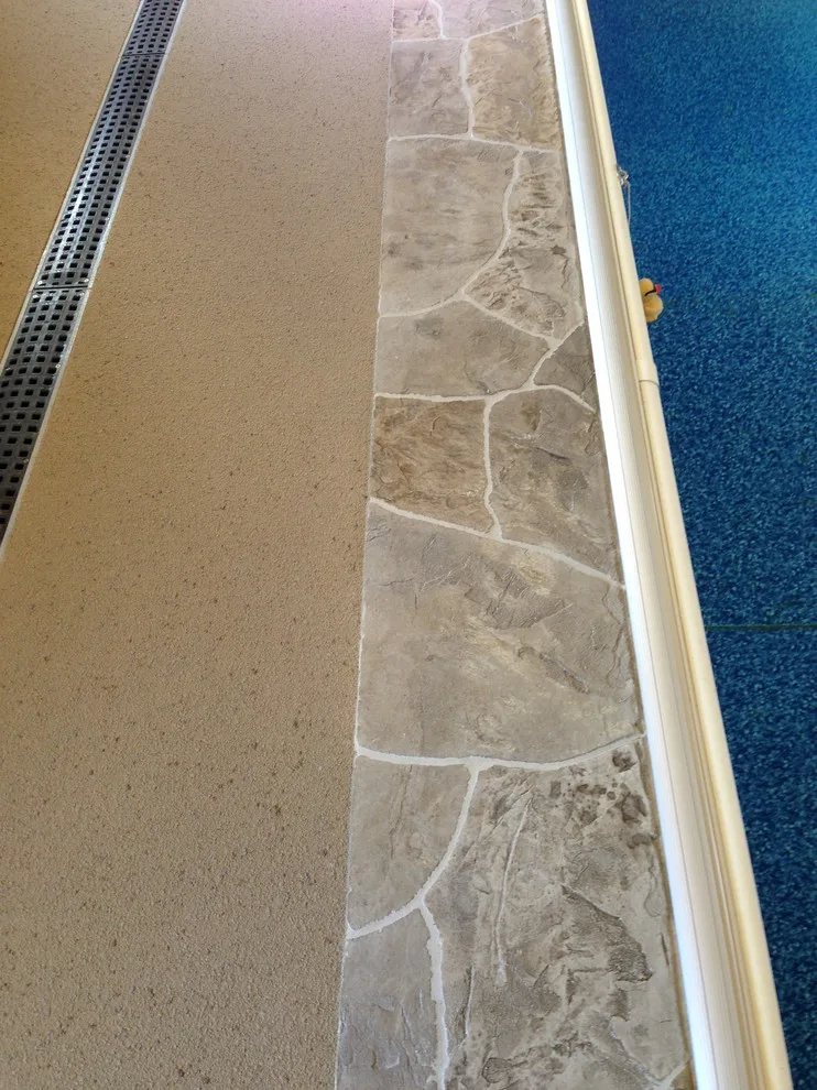 Textured Spray Finish on Stamped Stone Pool Coping and Deck by Elite Concrete Design - Photo 6