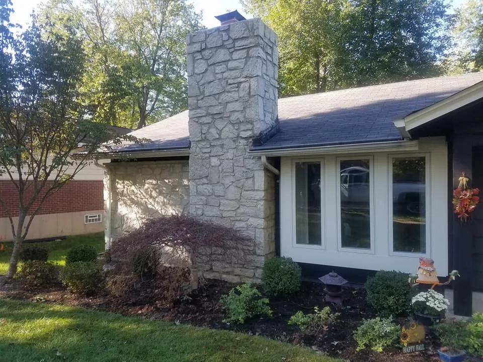 Tuck-pointing stone chimney in Ballwin, Missouri by Masterpiece Masonry - Photo 3