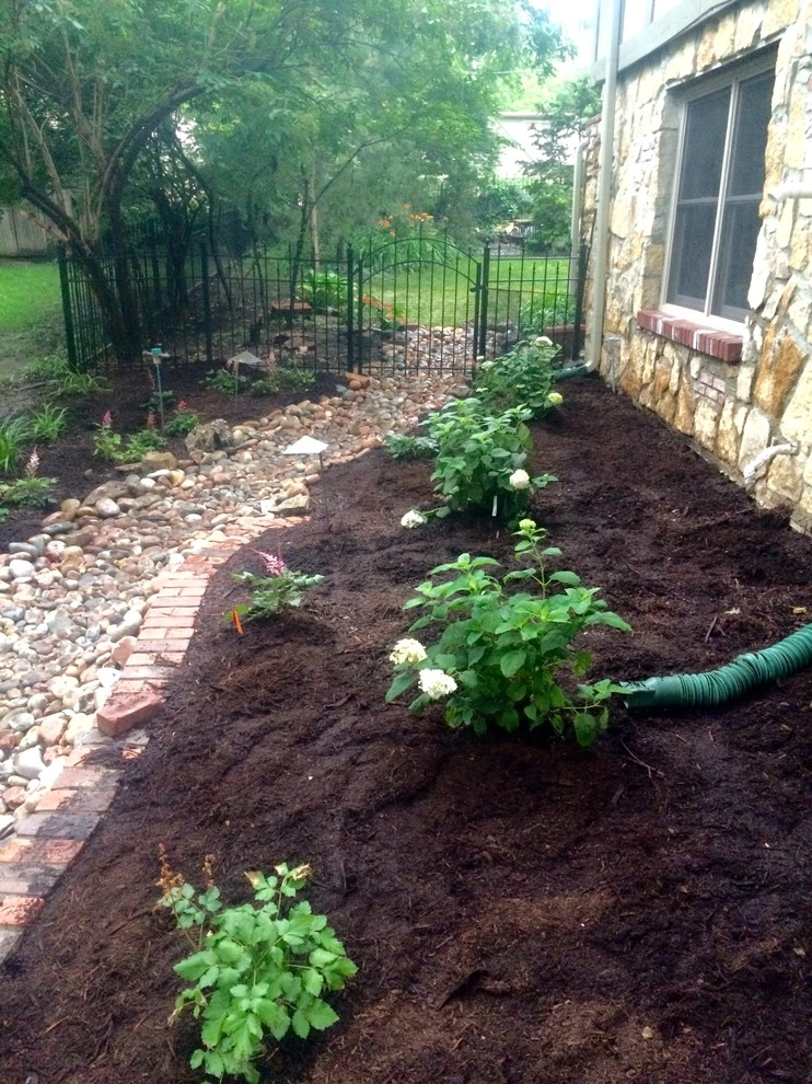 Dry creek bed by Zach's Lawn & Landscaping - Photo 5