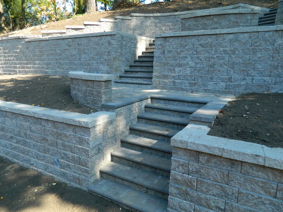 Layered walls and staircases with platforms by Devine Design Hardscapes - Photo 7