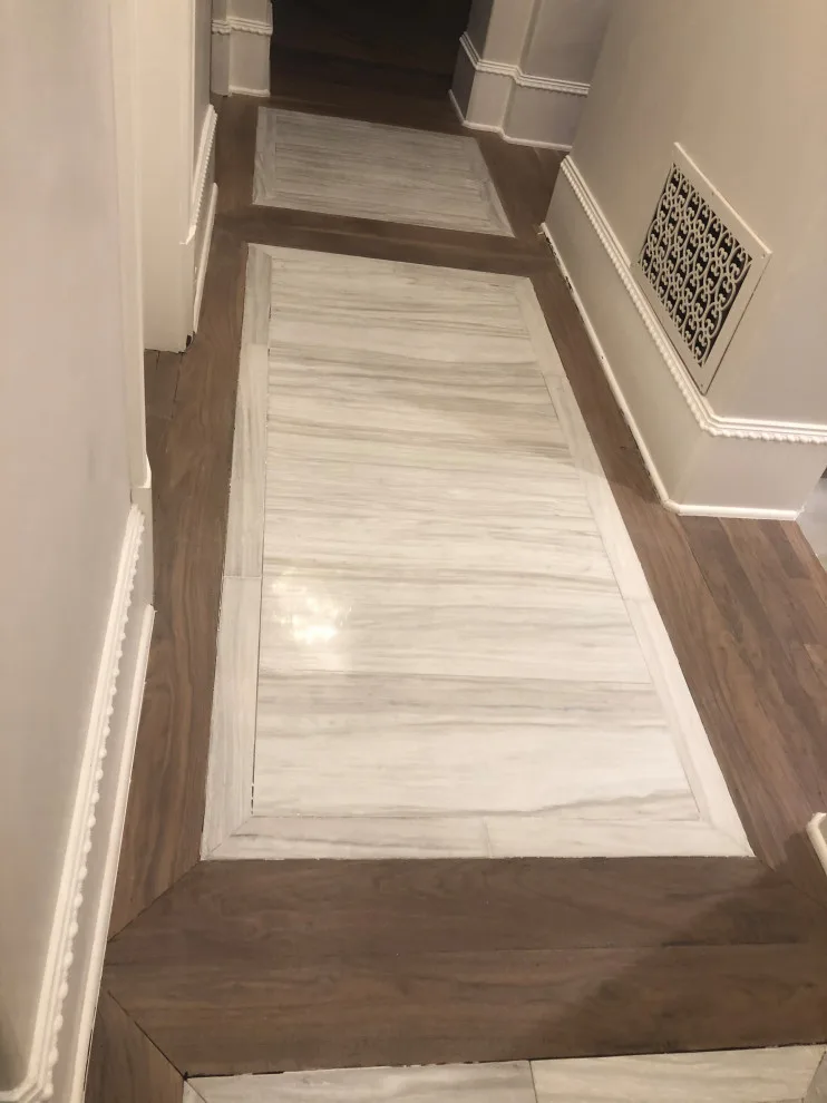 Wood flooring renovation and marble inlays modification by Fine Line Flooring Inc. - Photo 6