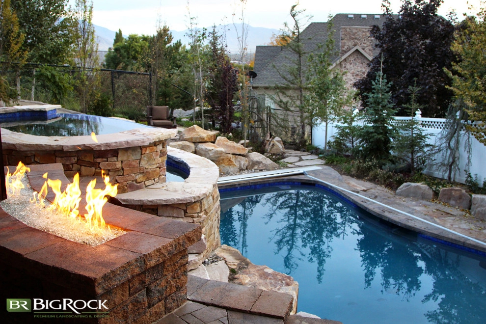 Rustic Pool With Hot Tub And Natural Landscaping by Big Rock Landscaping - Photo 19