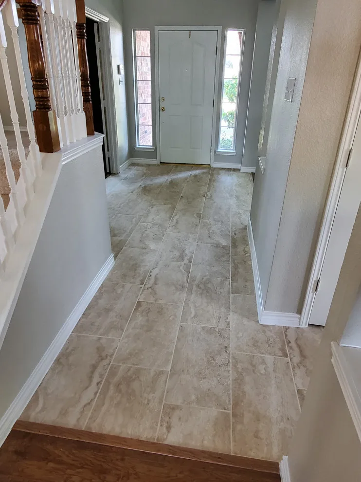 Updated kitchen flooring and tile backsplash by Footprints Floors | McKinney - Photo 11