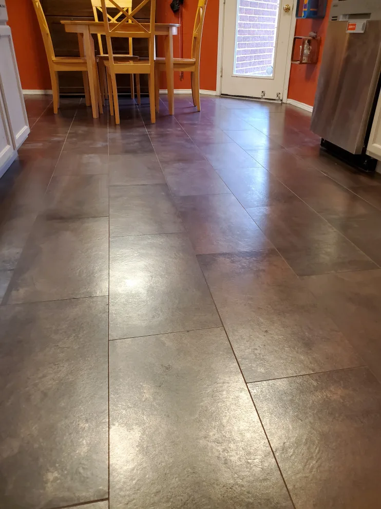 Updated kitchen flooring and tile backsplash by Footprints Floors | McKinney - Photo 5