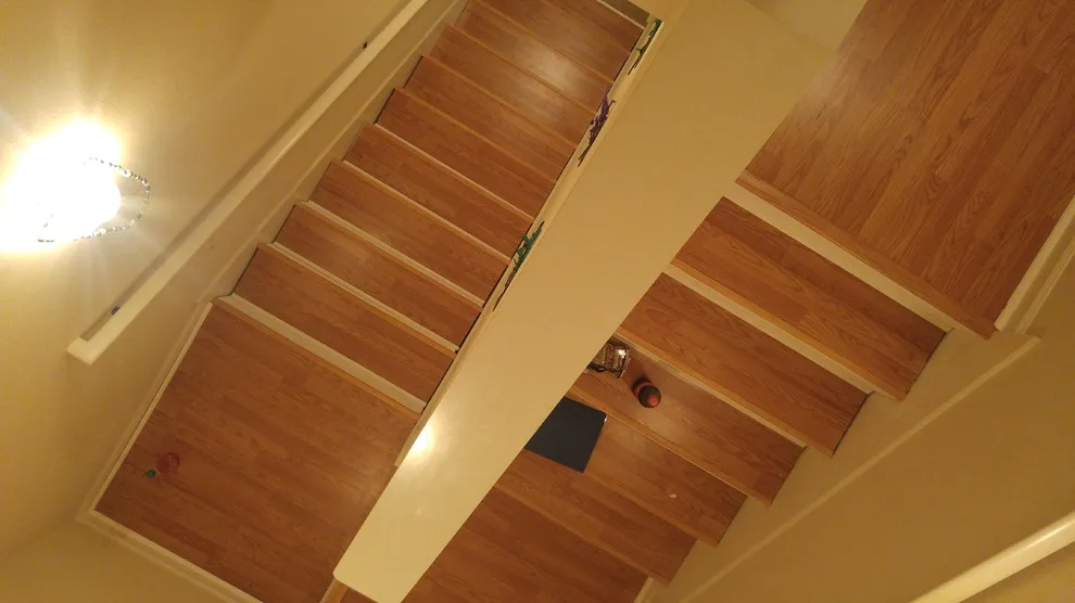 Two-Story Laminate Installation for Residents by Irvs Floor And More - Photo 40