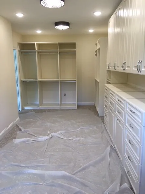 Primary Wardrobe by Tailored Living Featuring Premier Garage - Photo 12