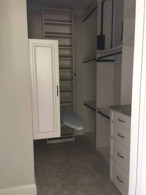 Primary Wardrobe by Tailored Living Featuring Premier Garage - Photo 9
