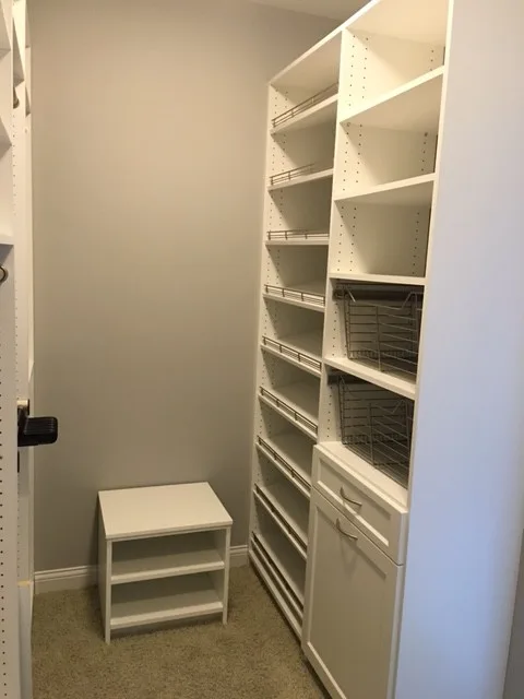 Primary Wardrobe by Tailored Living Featuring Premier Garage - Photo 13