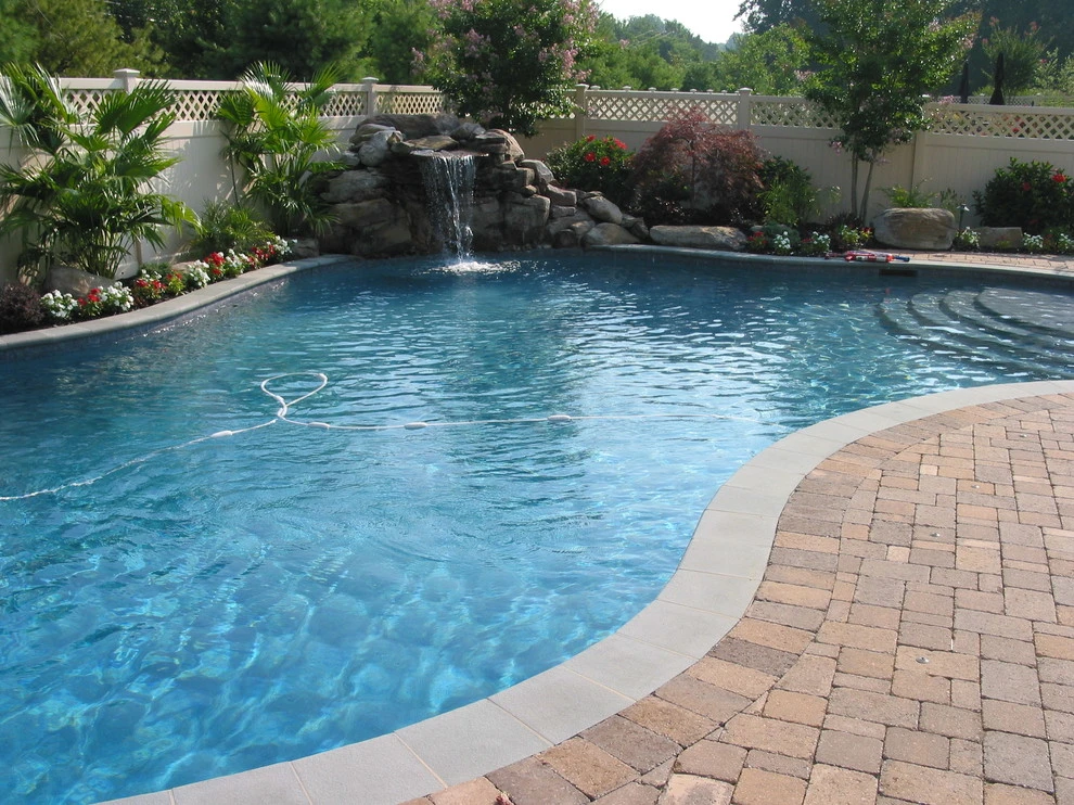 Arnold Pool with Natural Stone Waterfall by Honeysuckle Nursery & Design - Photo 10