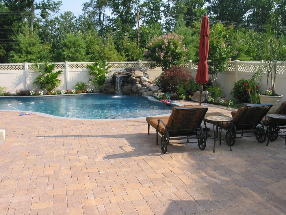 Arnold Pool with Natural Stone Waterfall by Honeysuckle Nursery & Design - Photo 6