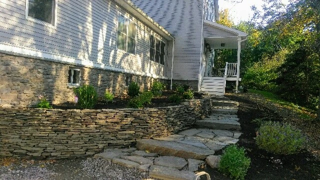 lake house landscape by Aureli Landscaping & Custom Stone Work - Photo 3