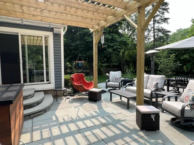 Total back yard transformation by Aureli Landscaping & Custom Stone Work - Photo 2