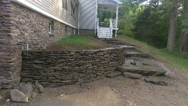 lake house landscape by Aureli Landscaping & Custom Stone Work - Photo 2