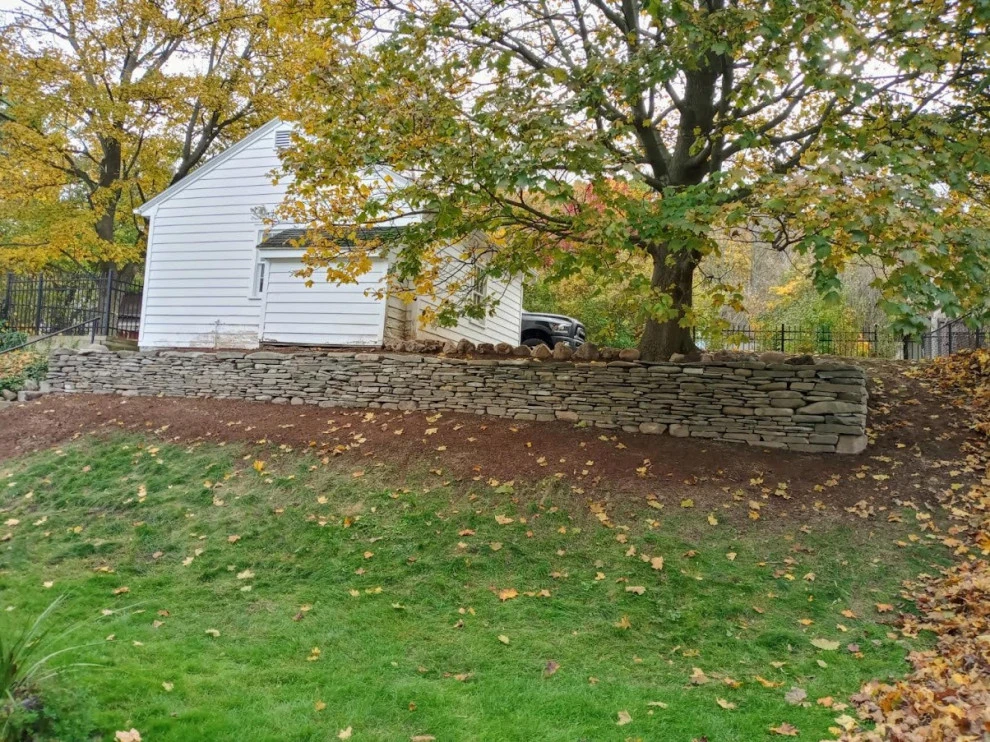 dry stacked wall by Aureli Landscaping & Custom Stone Work - Photo 2