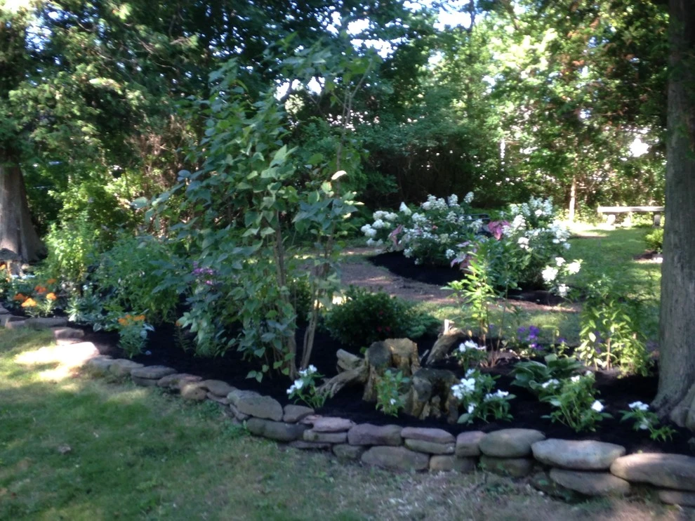 Renovated Lake property gardens by Aureli Landscaping & Custom Stone Work - Photo 4
