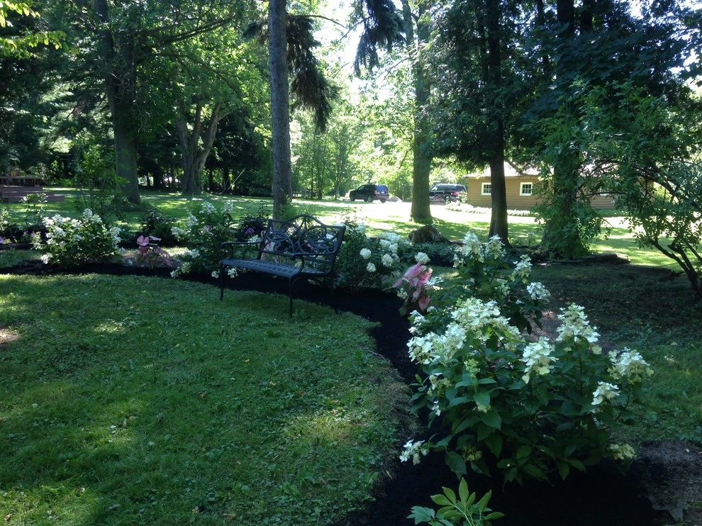 Renovated Lake property gardens by Aureli Landscaping & Custom Stone Work - Photo 3
