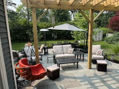 Total back yard transformation by Aureli Landscaping & Custom Stone Work - Photo 6