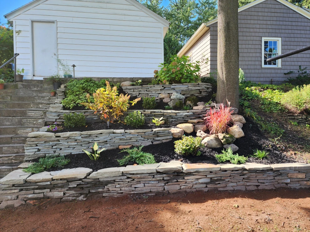 dry stacked wall by Aureli Landscaping & Custom Stone Work - Photo 3