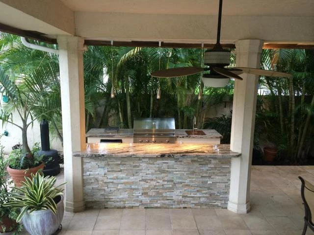 Outdoor Kitchen with Ledge Stone by Broward Landscape, Inc. - Photo 11