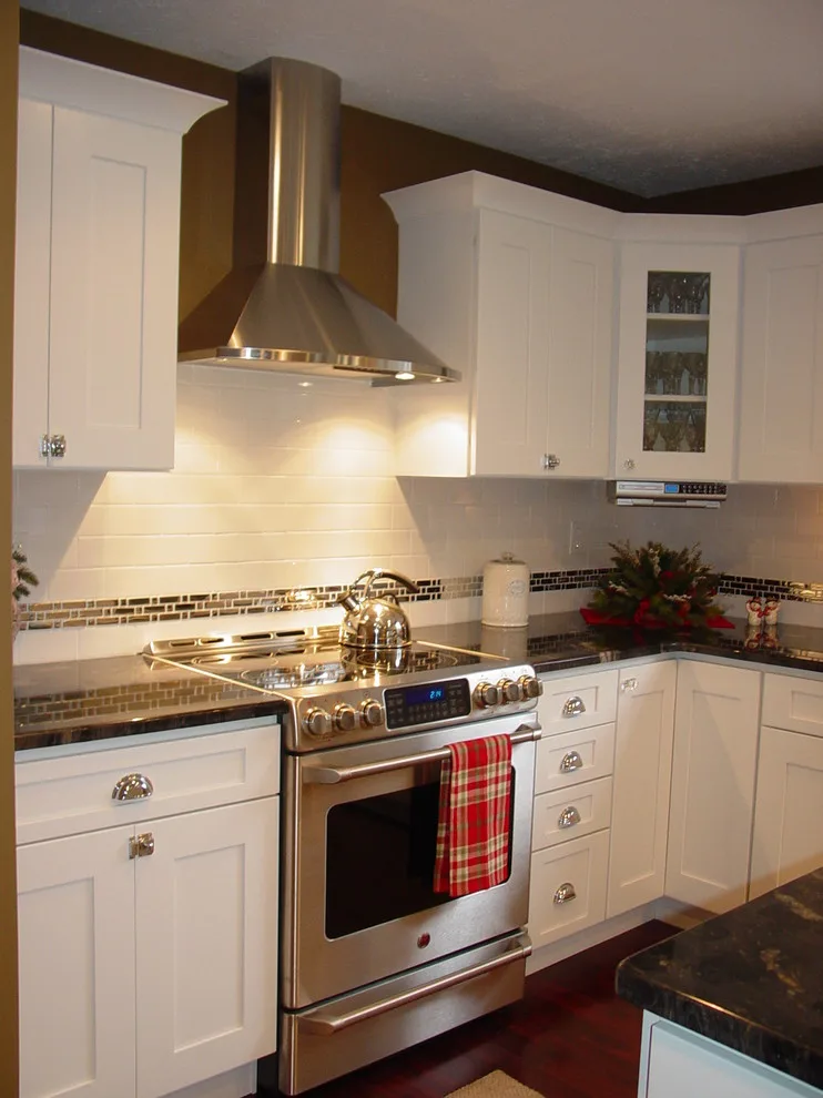 Elegant Kitchen Renovation by Solon White by Kitchen And Bath Etc. - Photo 3