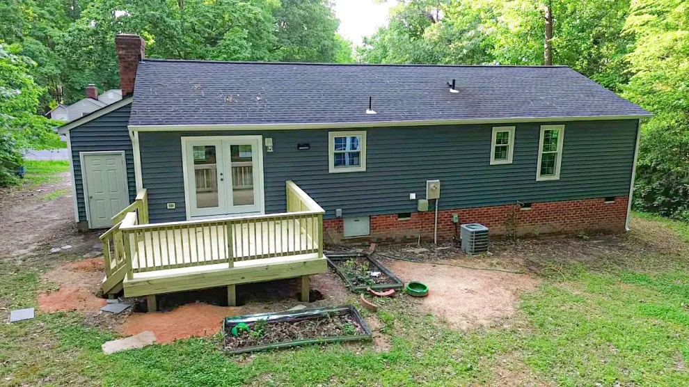 Exterior renovation - siding, window, and gutter replacement by Hammer & Nail Home Improvement, LLC - Photo 6