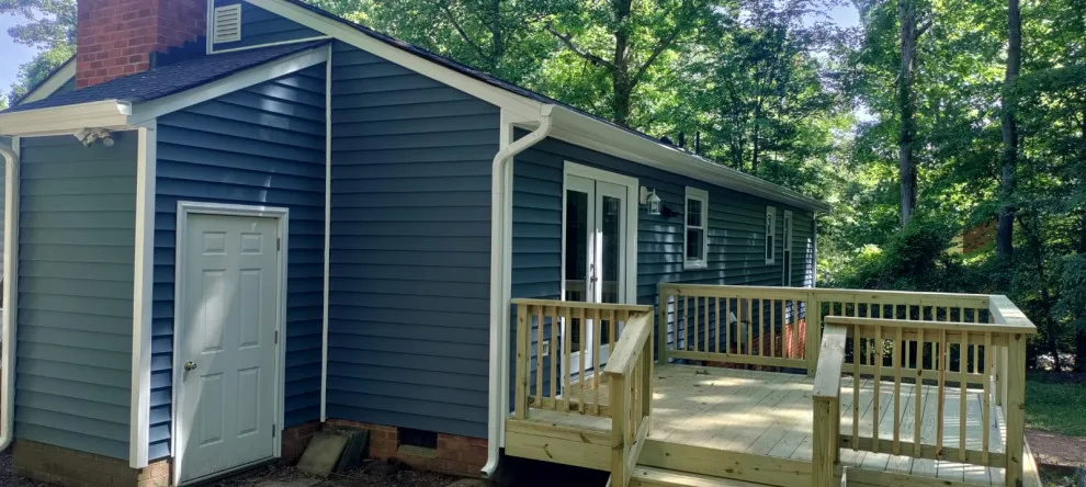 Exterior renovation - siding, window, and gutter replacement by Hammer & Nail Home Improvement, LLC - Photo 9